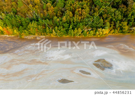 Top down view on river rich in mineral waste 44856231