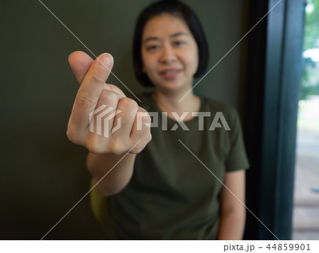 Asian woman shows mini heart sign Asian woman shows mini heart sign 44859901