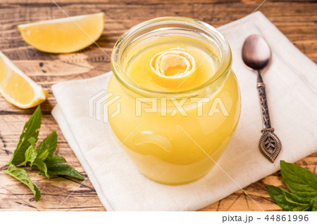 Homemade lemon curd in glass jars with fresh lemon 44861996