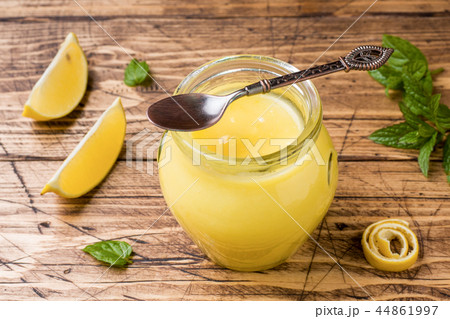Homemade lemon curd in glass jars with fresh lemon Homemade lemon curd in glass jars with fresh lemon 44861997