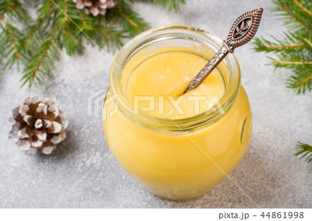 Homemade lemon curd in glass jars on the table. Homemade lemon curd in glass jars on the table. 44861998