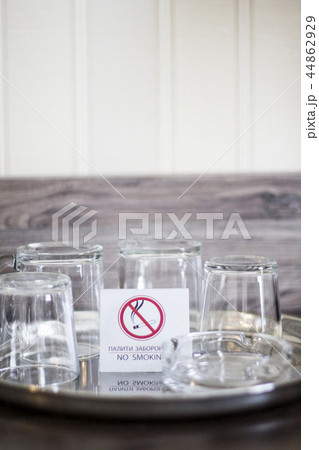 Glass cups with a plate No smoking. Glasses  44862929