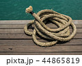 Rope on a hardwood floor above the sea. Rope on a hardwood floor above the sea. 44865819