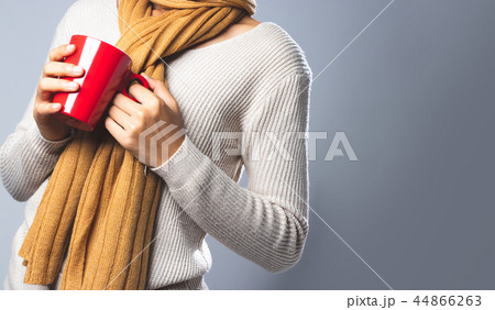 Woman drinking hot coffee in winter. 44866263