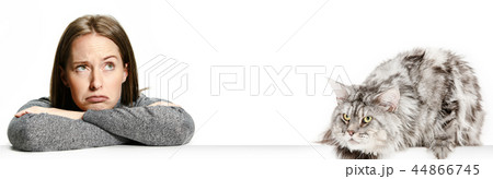 Woman with her cat over white background 44866745