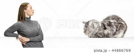 Woman with her cat over white background 44866769