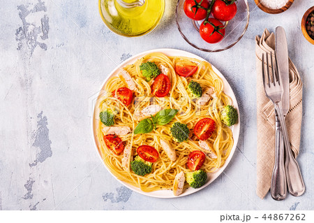 Plate of spaghetti tomato broccoli chicken Plate of spaghetti tomato broccoli chicken 44867262