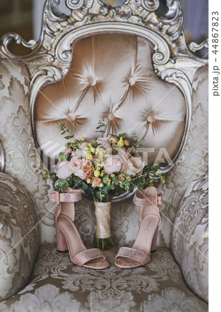 Wedding bouquet of roses and pink shoes on  44867823