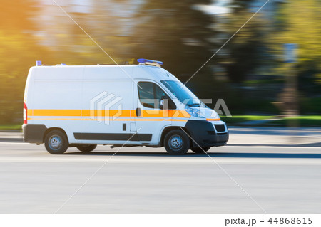 Ambulance in the city on a blurred background Ambulance in the city on a blurred background 44868615