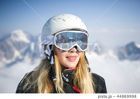 Young adult woman snowboarder or skier in snow Young adult woman snowboarder or skier in snow 44869998