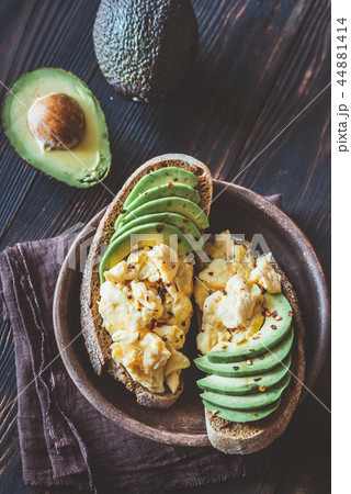 Sandwiches with avocado and scrambled eggs Sandwiches with avocado and scrambled eggs 44881414
