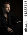 young man close up portrait, on black background 44882443