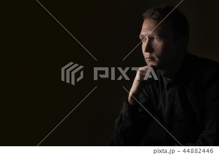 young man close up portrait, on black background young man close up portrait, on black background 44882446