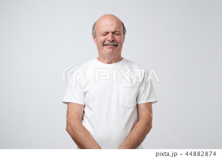 Unhappy senior man crying. He is offended 44882874
