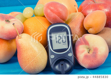 Glucose meter and fruits containing vitamins 44885830
