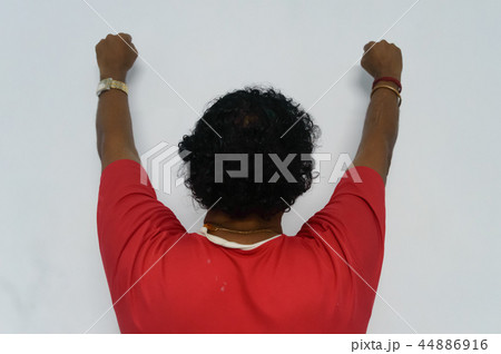 Old man with hands up, back view. Old man with hands up, back view. 44886916