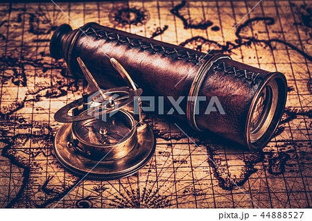 Old vintage compass on ancient map 44888527