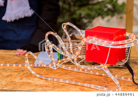 Gift box on Santa's sleigh firure close up 44889491