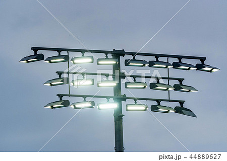 Airport landing lights against grey sky close Airport landing lights against grey sky close 44889627