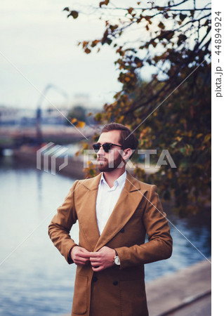 Confident young man in suit or coat Confident young man in suit or coat 44894924