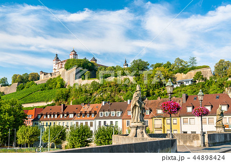 Statue on the Alte Mainbrucke and Marienberg Fortress in Wurzburg, Germany 44898424