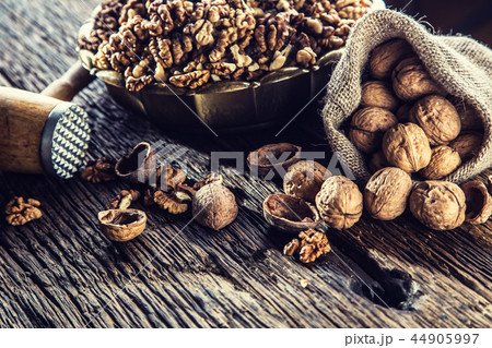 Walnut kernels whole walnuts in burlap sack. Walnut kernels whole walnuts in burlap sack. 44905997