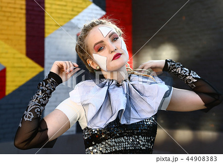 Portrait of a girl clown outdoors Portrait of a girl clown outdoors 44908383