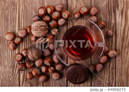 Autumn harvest. Top view of tea, nuts Autumn harvest. Top view of tea, nuts 44909275