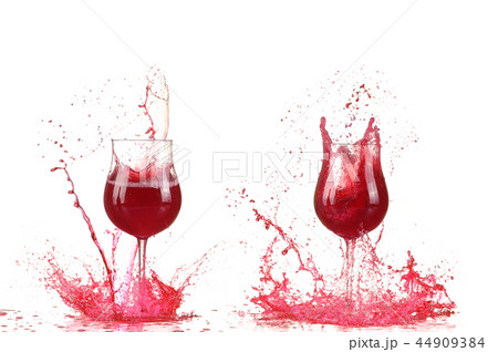 Glass with red wine splash Glass with red wine splash 44909384