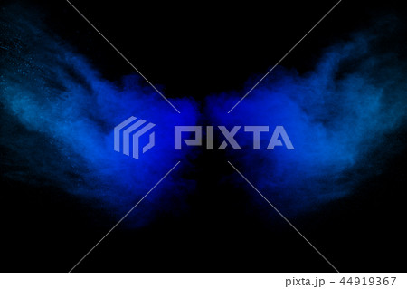 Launched blue dust particles splash on black . 44919367