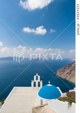 sunset over aegean sea with view to Virgin Mary Catholic Church Three Bells of Fira, Santorini. sunset over aegean sea with view to Virgin Mary Catholic Church Three Bells of Fira, Santorini. 44924353