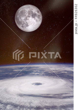 hurricane over the ocean with full moon in backgro hurricane over the ocean with full moon in backgro 44926302