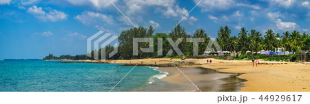 View of blue sea and stones and beach at sunset View of blue sea and stones and beach at sunset 44929617