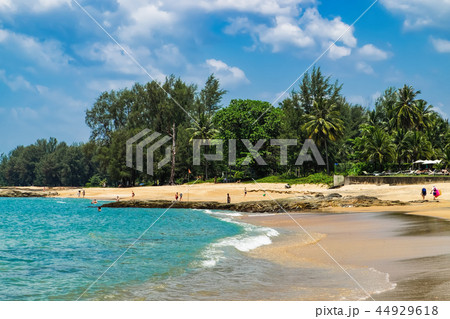 View of blue sea and stones and beach at sunset View of blue sea and stones and beach at sunset 44929618