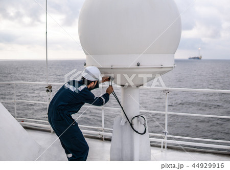 Service technician or serviceman near VSAT terminal 44929916