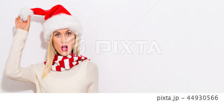 Happy young woman with Santa hat 44930566