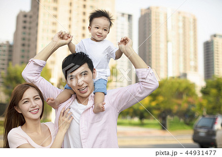 Young family with baby having fun in city park Young family with baby having fun in city park 44931477