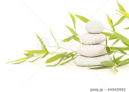 Pile of white stones with bamboo Pile of white stones with bamboo 44940992
