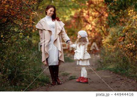 charming beautiful mother walks with little daughter girl 44944416