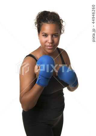 Young pretty black woman with boxing gloves Young pretty black woman with boxing gloves 44946260