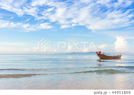 beautiful beach in the morning with fisherman boat 44951809