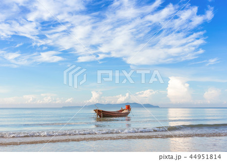 beautiful beach in the morning with fisherman boat 44951814
