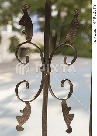 Fragment of a figured forged the metal fence. Fragment of a figured forged the metal fence. 44952688