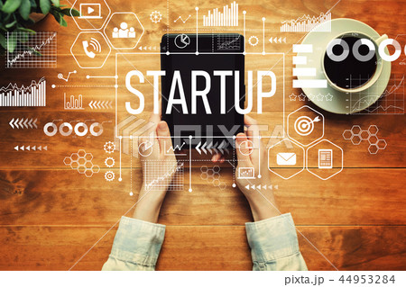Startup with a person holding a tablet 44953284
