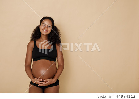 Studio portrait of pregnant woman Studio portrait of pregnant woman 44954112