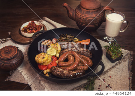 Grilled sausages with vegetables 44954124