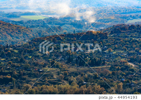 Beautiful autumn in the Mountains landscape with houses Beautiful autumn in the Mountains landscape with houses 44954193