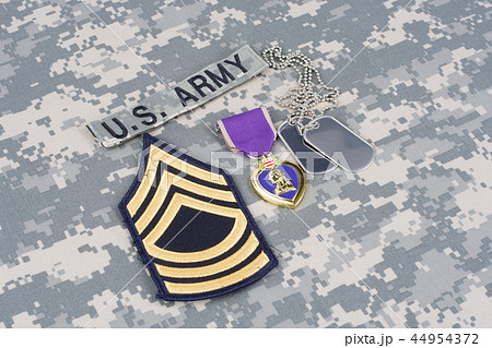 Purple Heart award with dog tags on uniform Purple Heart award with dog tags on uniform 44954372