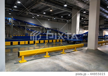 Baggage claim area with baggage carousels and carts Baggage claim area with baggage carousels and carts 44955015
