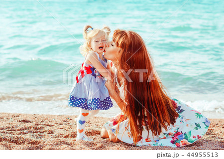 mother and daughter by the sea 44955513